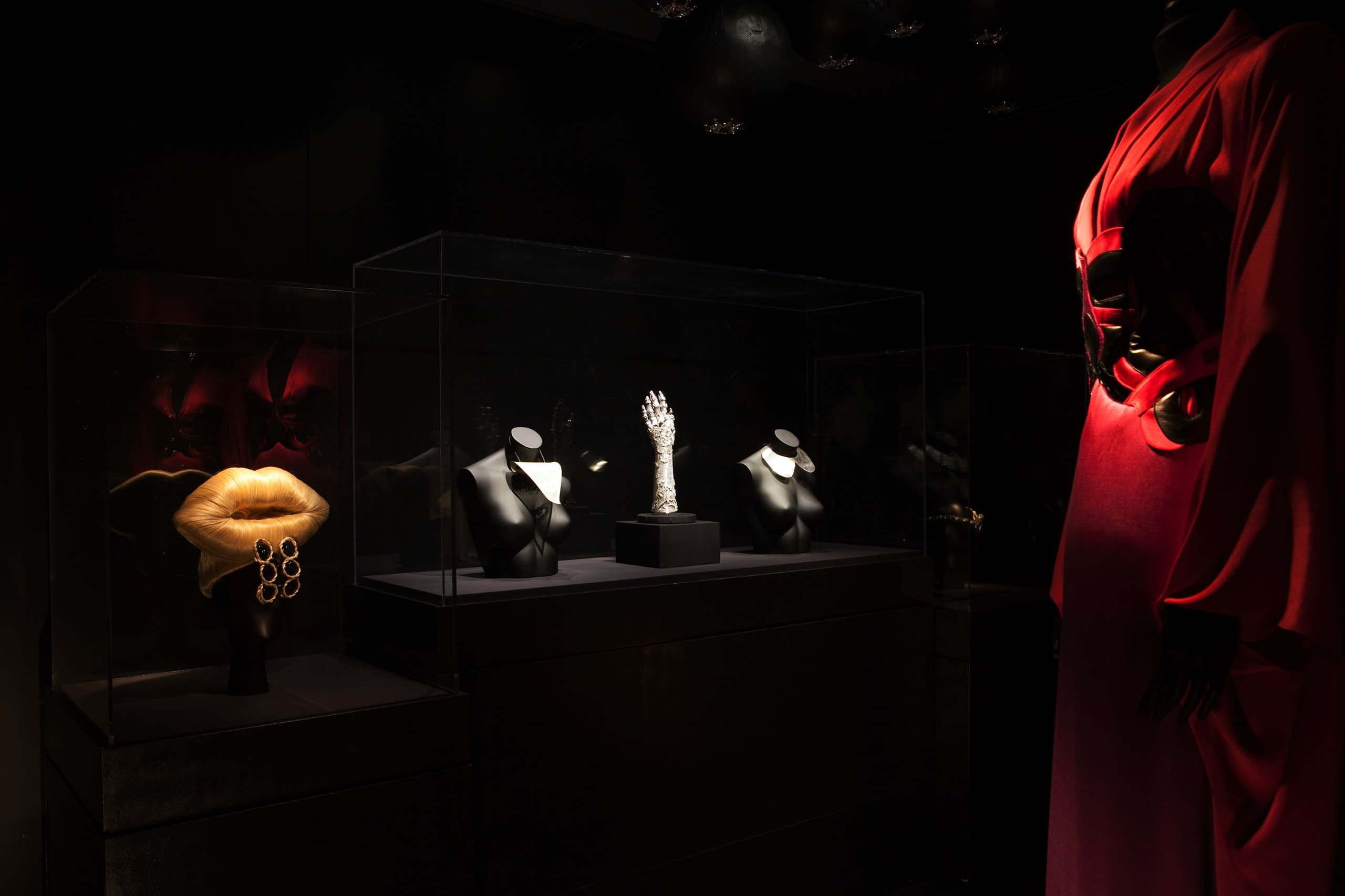 a display case with mannequins and jewelry