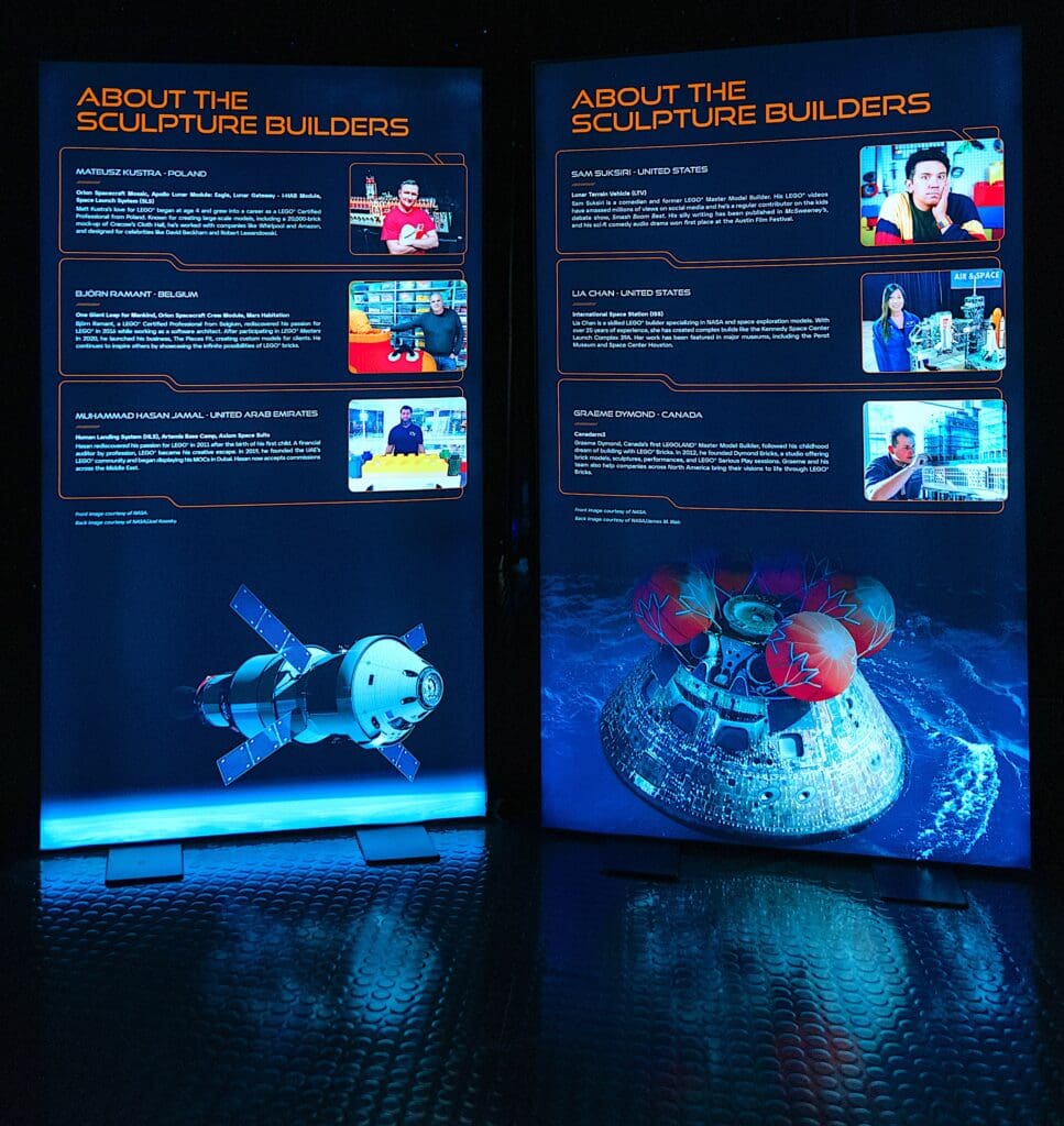 Two illuminated display boards present information about sculpture builders, including their names, photos, and projects from the Artemis Adventure with LEGO® Bricks touring exhibition, accompanied by images of spacecraft models built from LEGO bricks.
