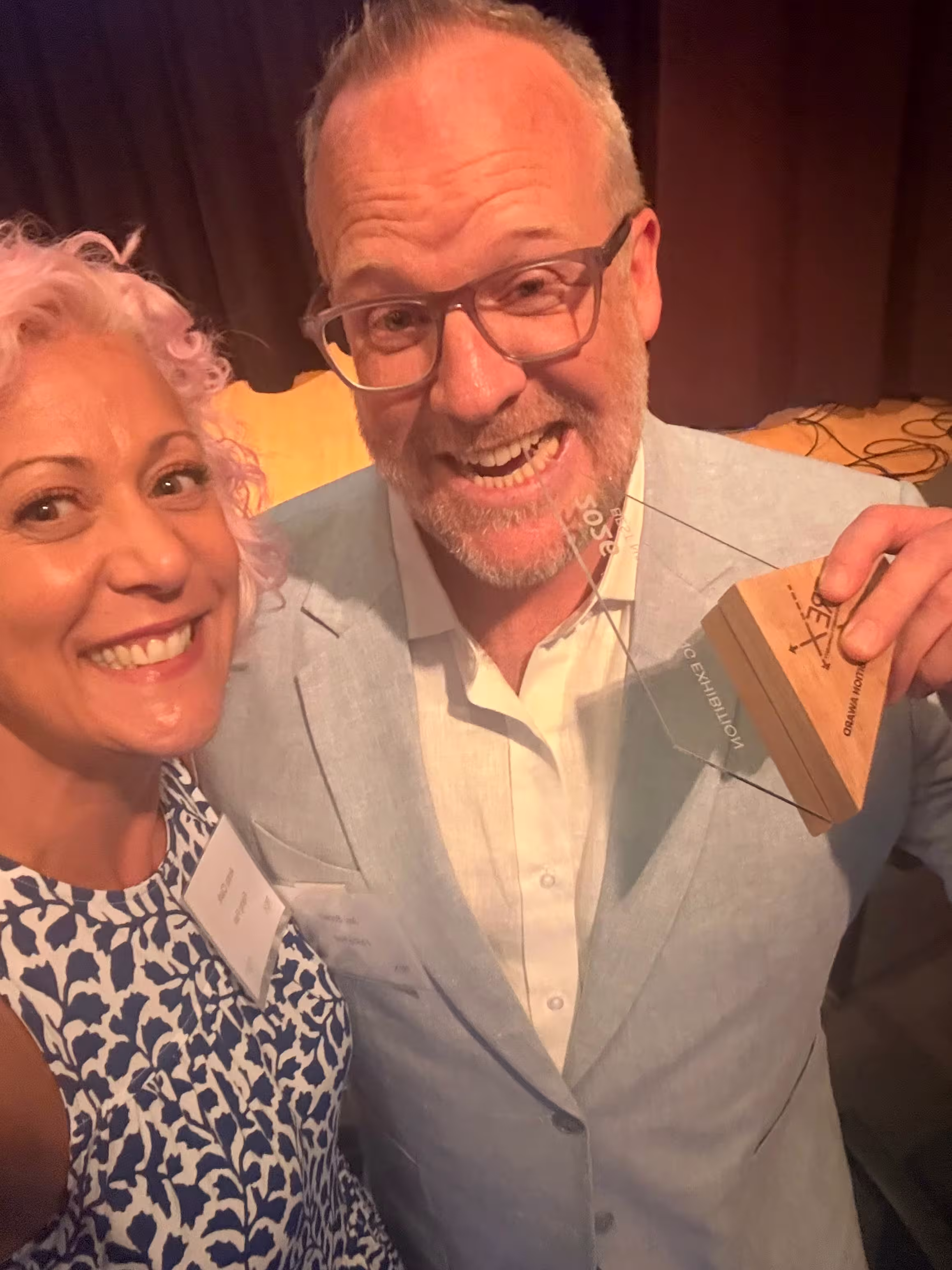 Flying Fish Principal & Managing Director, Jay Brown, and Director of Marketing & Sales, Anna Clark, celebrating TREX award
